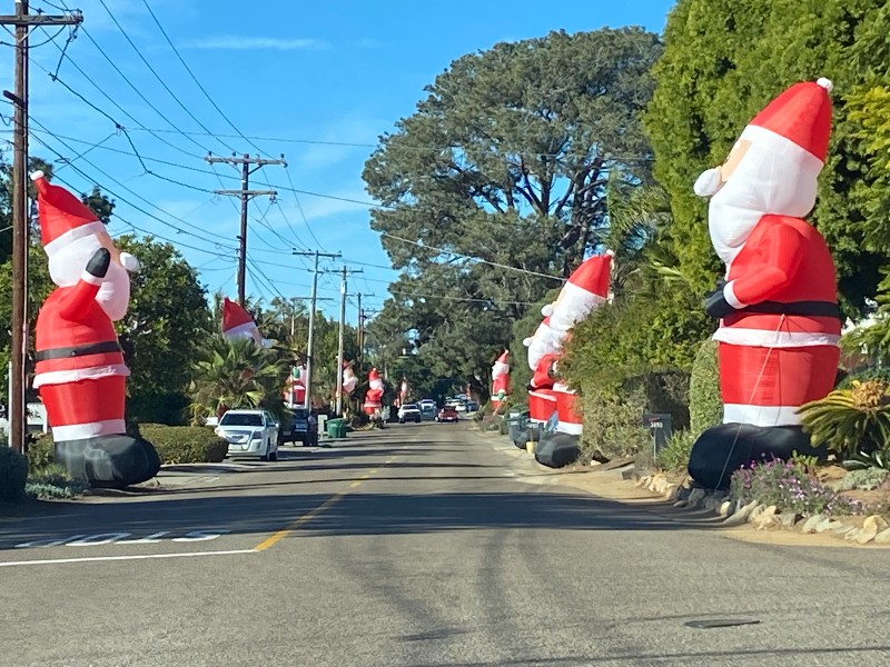 Inflatable Santas on Highland Drive in Carlsbad